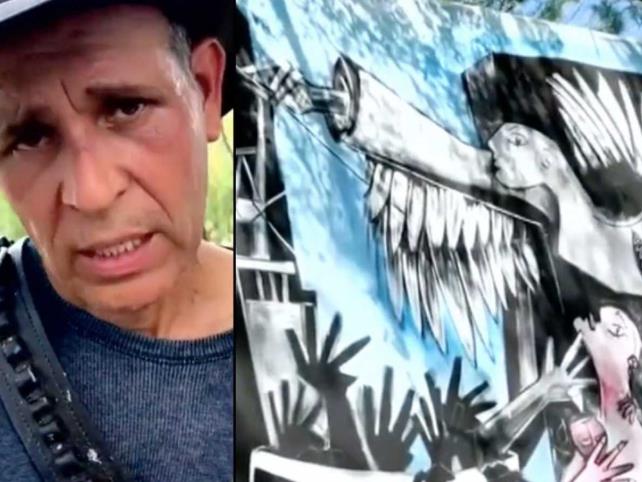 Artista pinta mural en honor de mineros